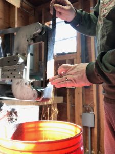 Surface grinding a chef knife as part of the knife making process