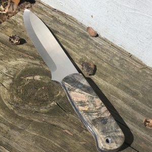 A bushcraft knife with a wooden handle and blue liners